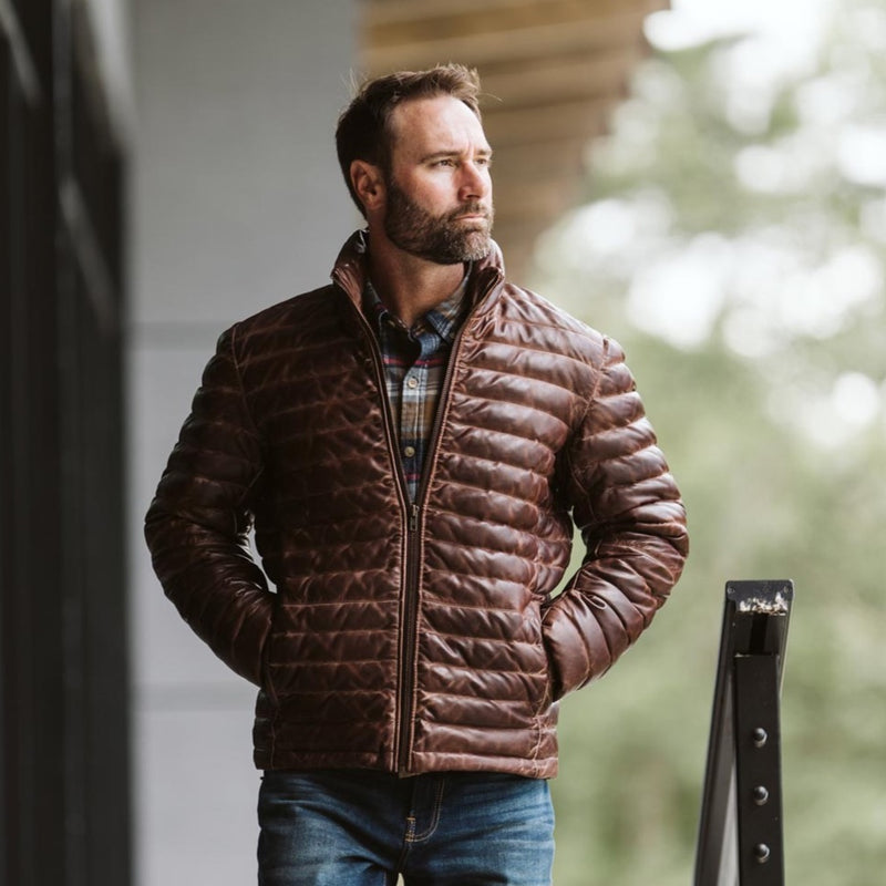 Authentic Buffalo Jackson Bridger Leather Down Jacket in dark brown full-grain lambskin leather, worn outdoors — sold only at 
